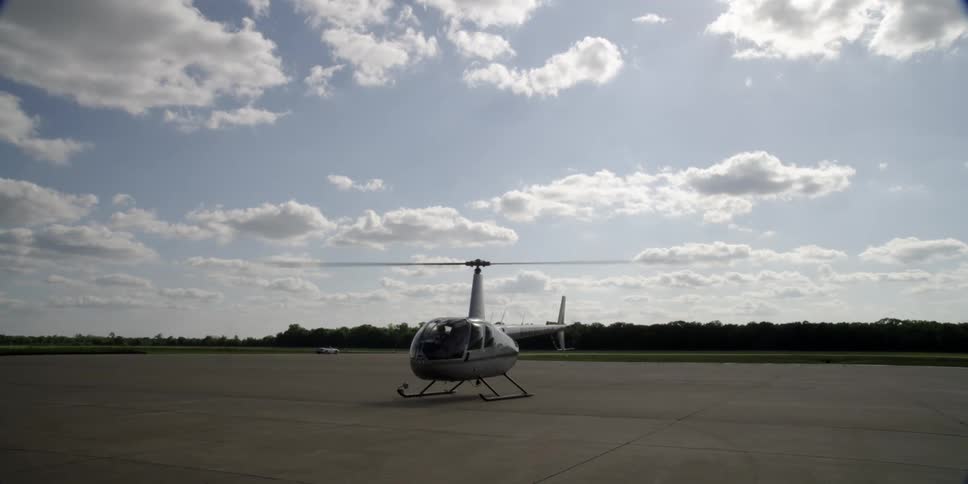 A helicopter is parked outdoors