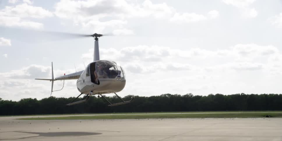 A man flying a helicopter