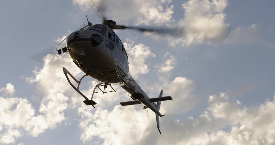 A helicopter is flying in the sky