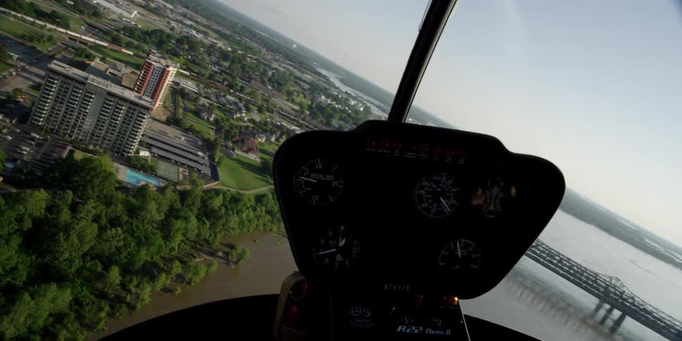 A helicopter flies over a city