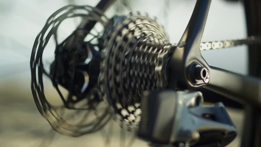 Close up of gears spinning on a spoke of bicycle wheel