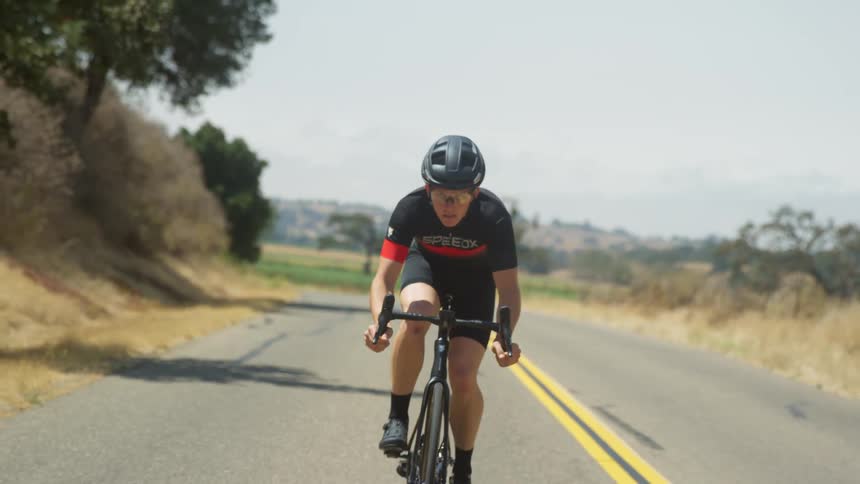 Cyclist riding uphill on a mountain road