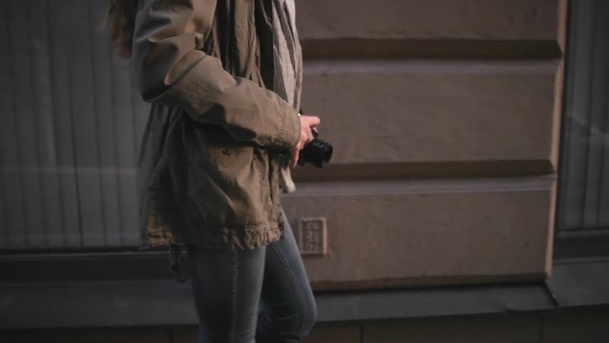 A person walks down a city street
