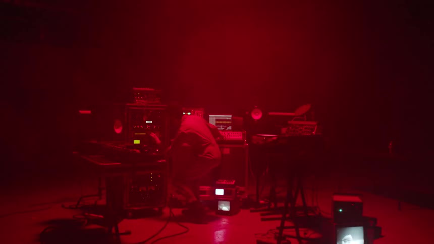 A man is playing music while using equipment