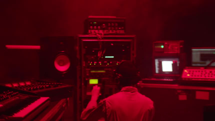 A man is playing music in a studio