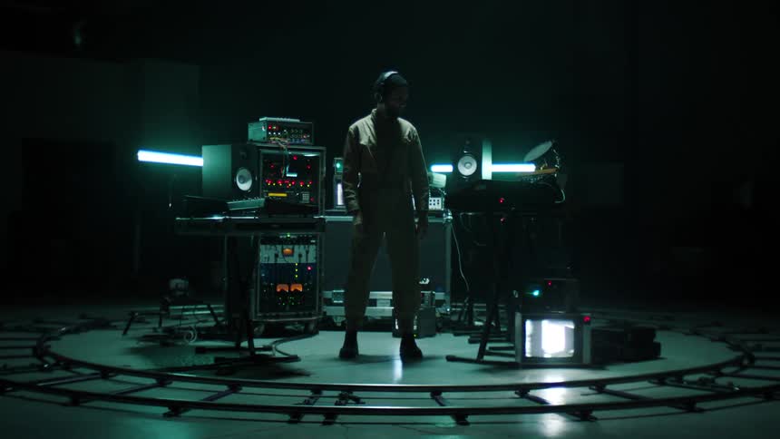 A man works with audio equipment