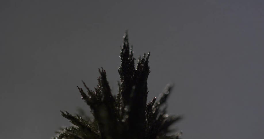 Spikes of metal shavings under moving lights