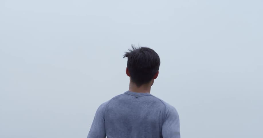A young man running outside