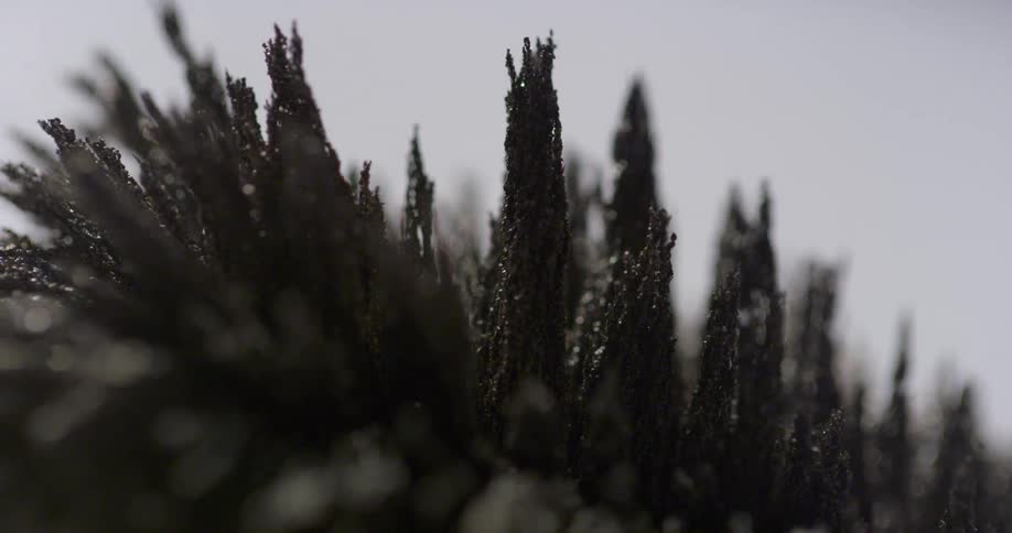 Spikes of metal shavings under moving lights
