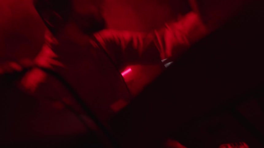 A man is hitting the computer with a stick