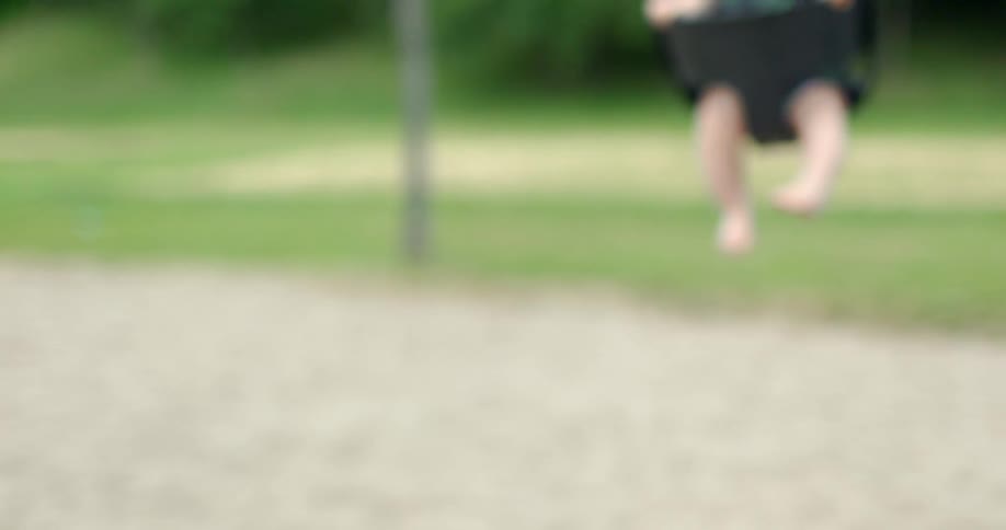 A baby swinging