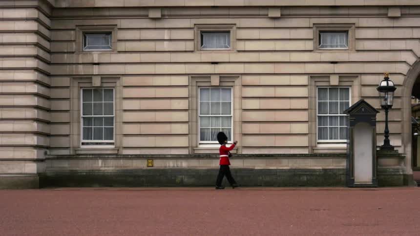 Queen's Guard on patrol in front of Buckingham Palace