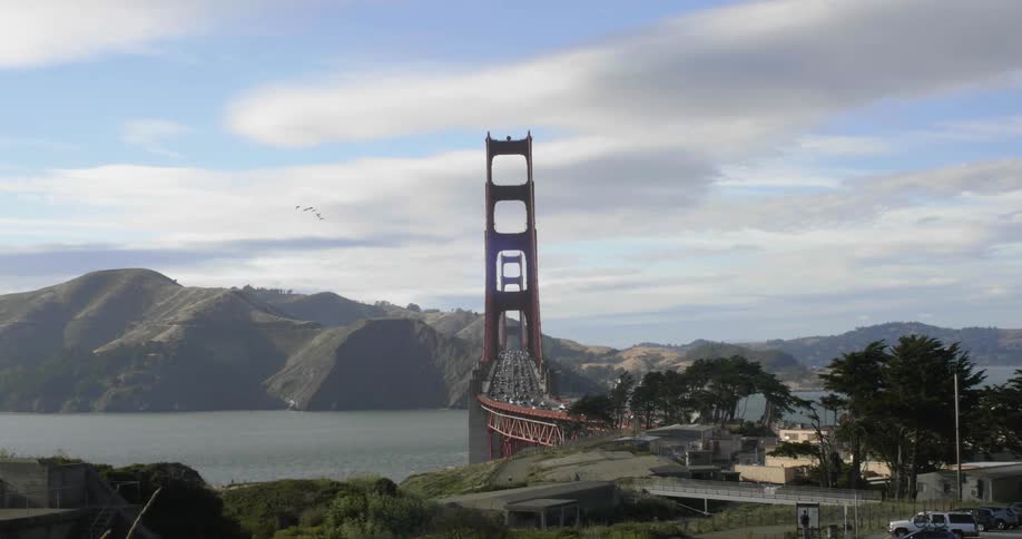 View of a bridge in the distance with cars passing over it