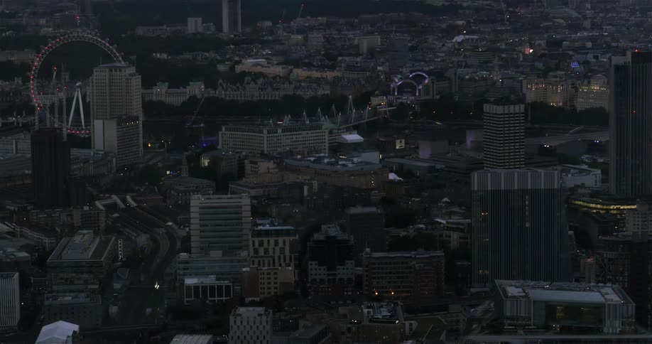 A city cluttered with buildings at dusk