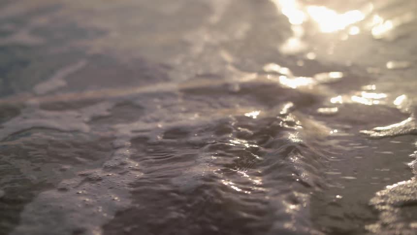 Waves washing onto a beach