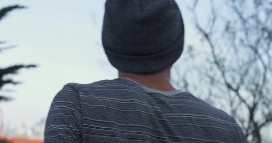 A young man walks outside