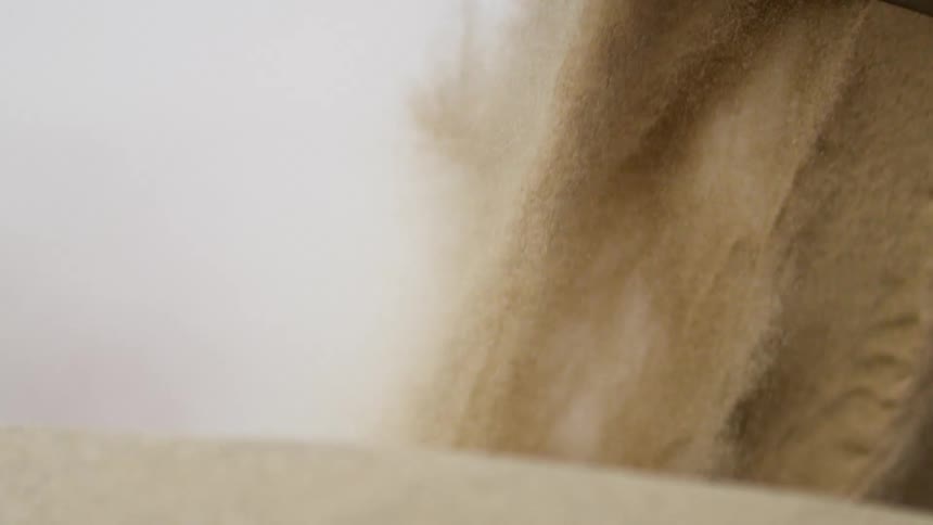 The grain is falling down in waves