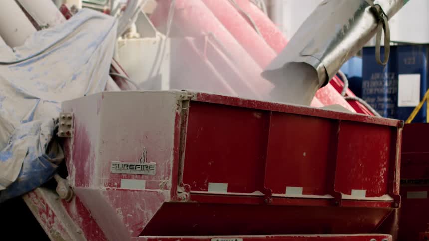 Material in powder form stored on a container in a factory