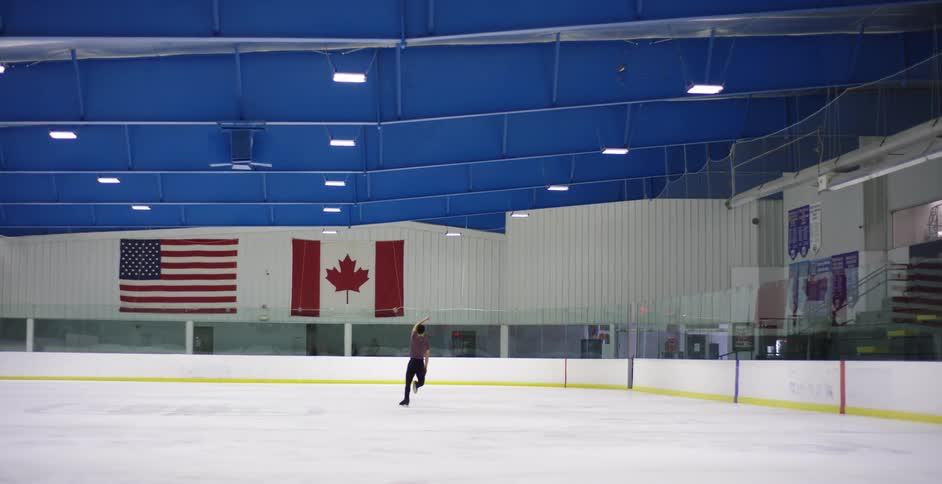 Figure skater on an indoors ice skate rink