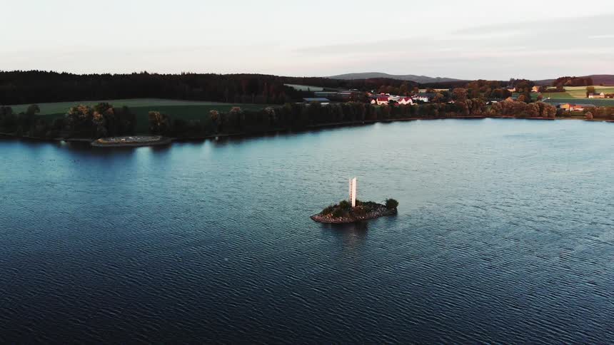 An aerial view of an island in the middle of the water