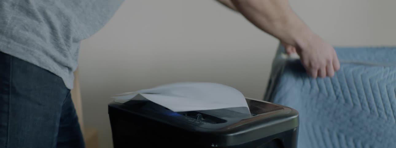 A man shredding papers