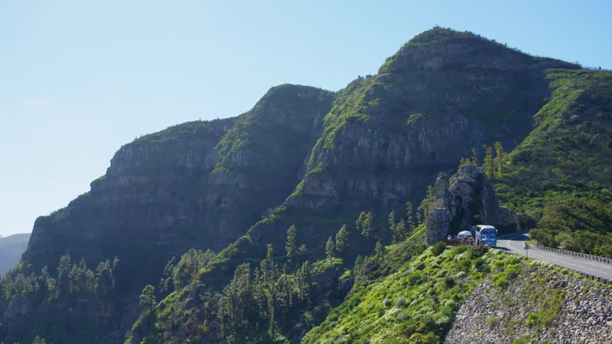 Green mountain landscape with a mountain highway