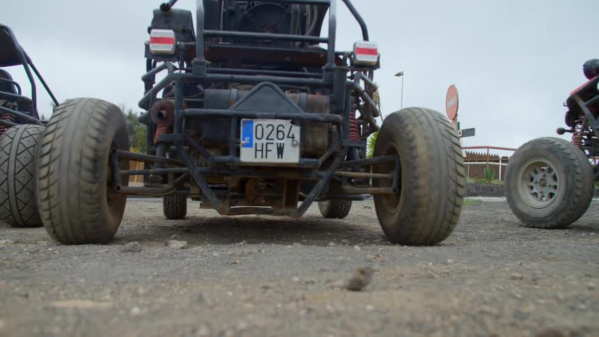 A man driving a dune buggy