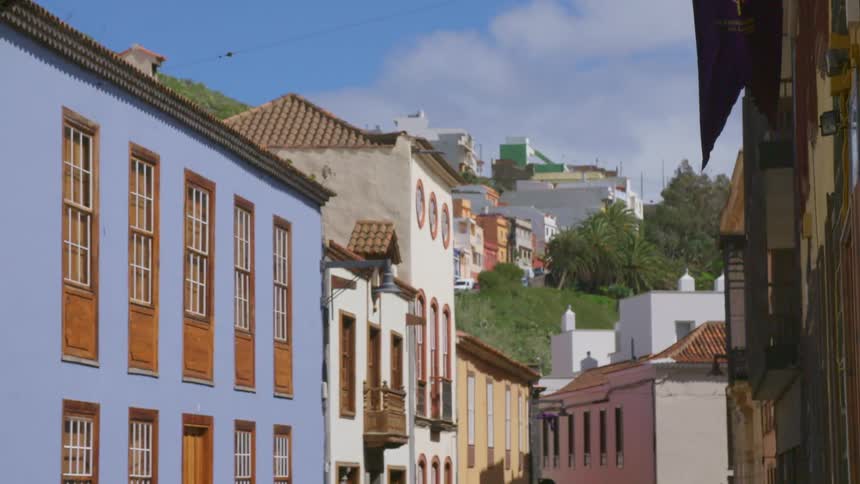 Colorful apartment buildings line the narrow streets of a town