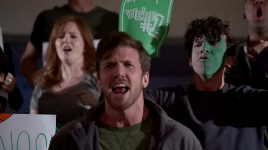 A crowd of people yelling at an event