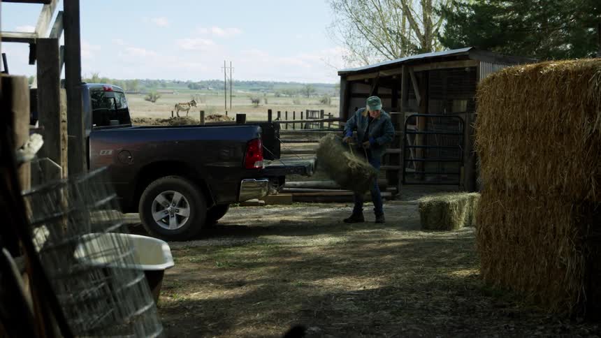 A man is taking items out of his truck