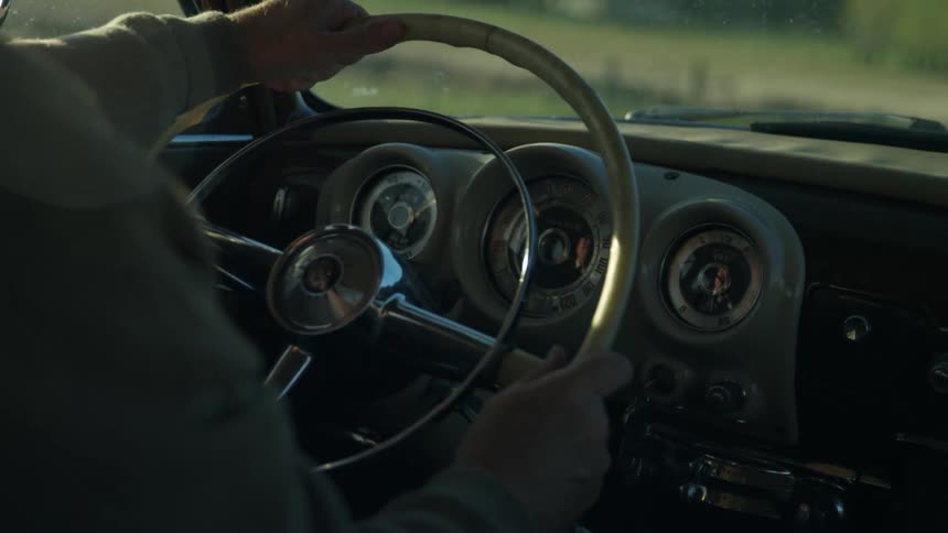 Interior of vintage steering wheel and dashboard in a classic car