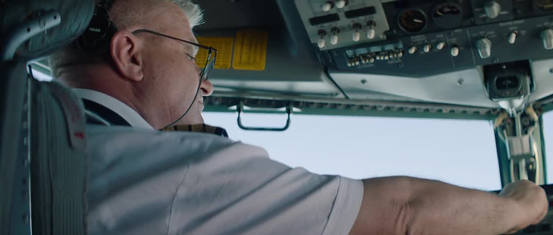 Pilot does a pre flight check up on airplane cockpit