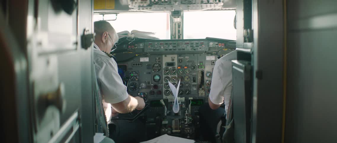 Pilot and copilot sitting in the cockpit of a plane