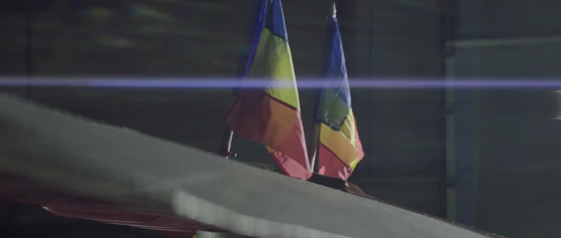 Two Romanian flags on a wing flap
