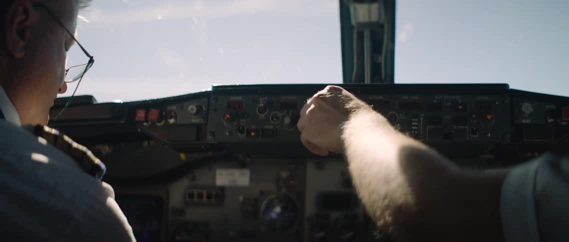 Two men in an airplane cockpit