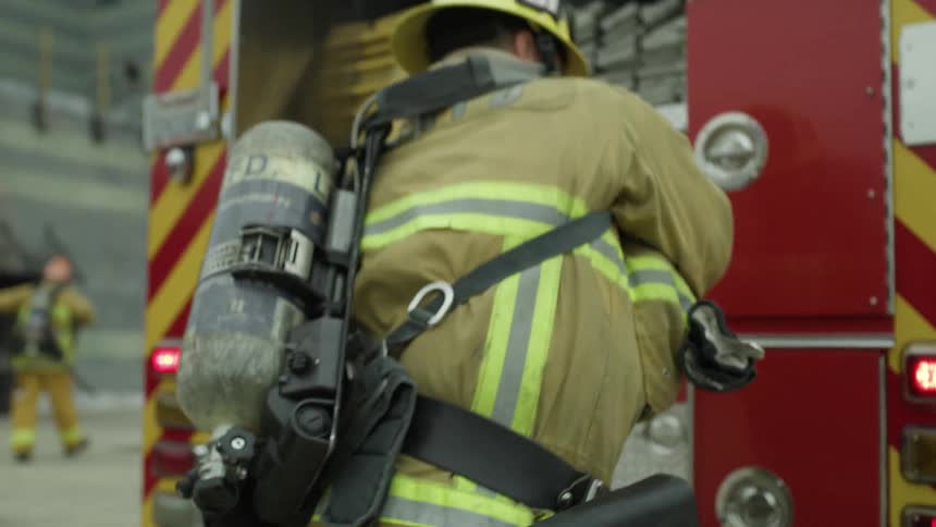A fire fighter is responding to a scene