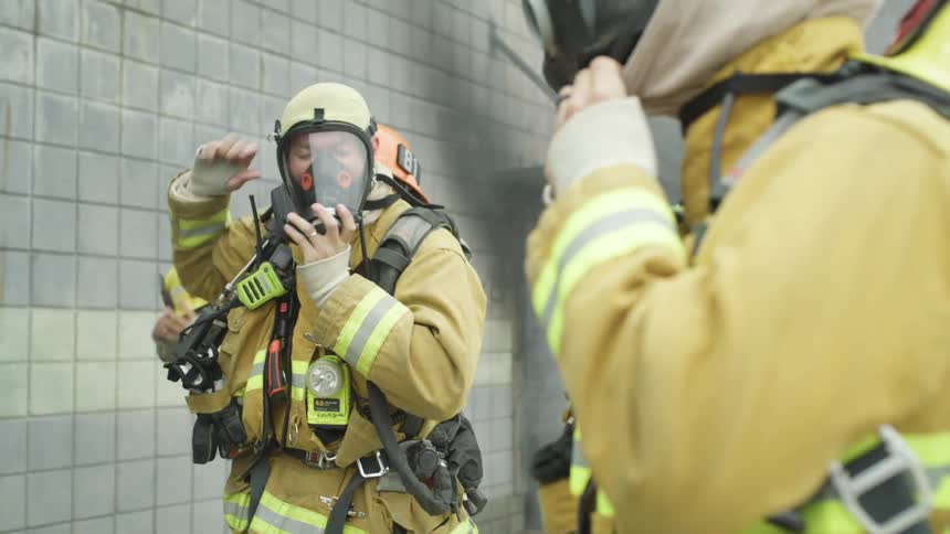 Firefighters putting on their equipment
