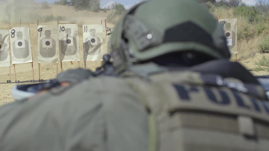 A soldier shoots at targets at a shooting range