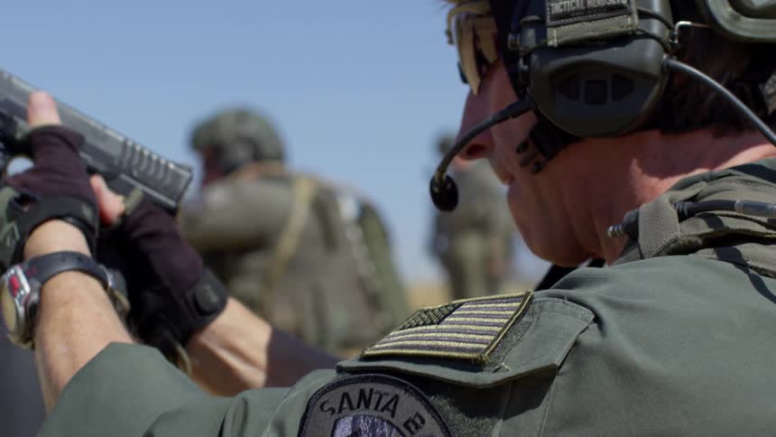 Soldiers point their guns on the firing range