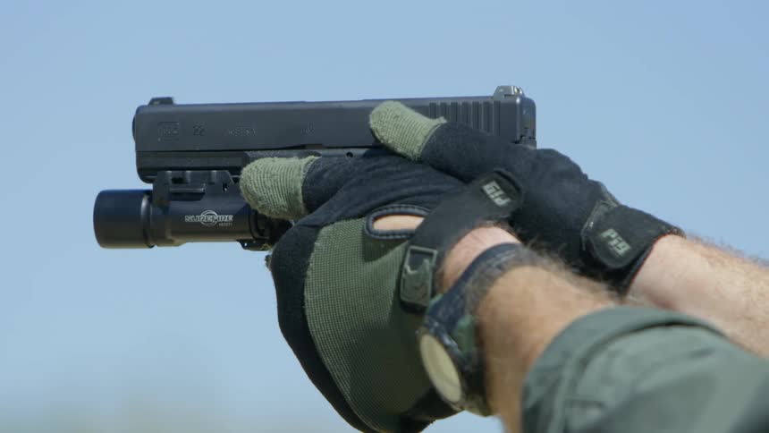 A soldier fires a gun