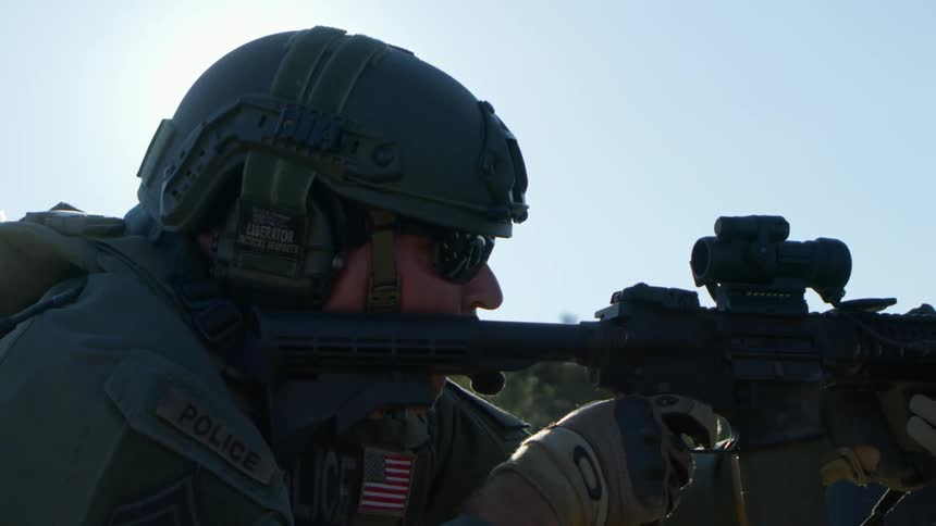 A soldier shoots his gun