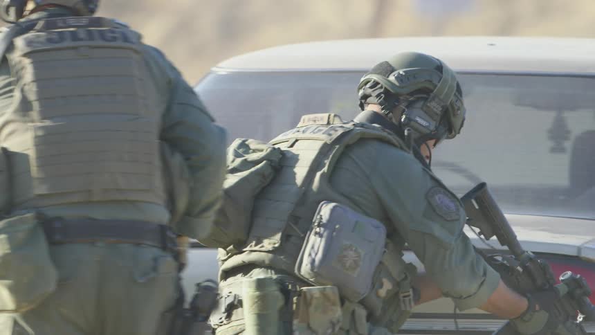 Group of police officers on military uniforms in a training exercise