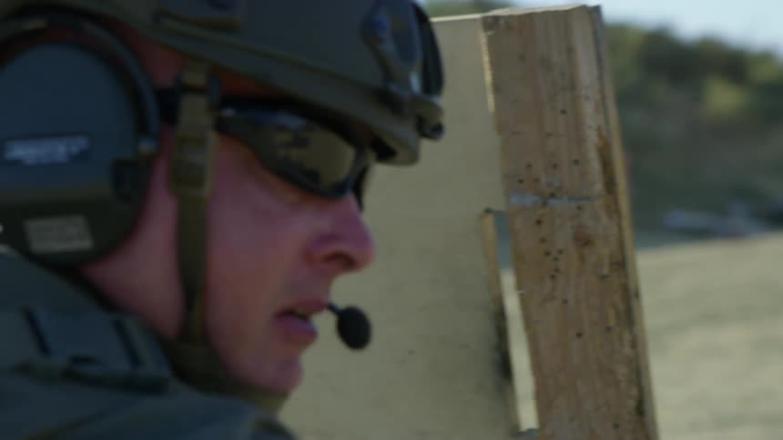 A soldier fires his gun