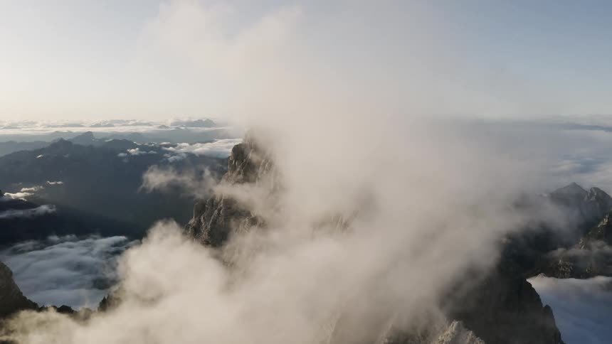 An aerial view of a mountain is displayed