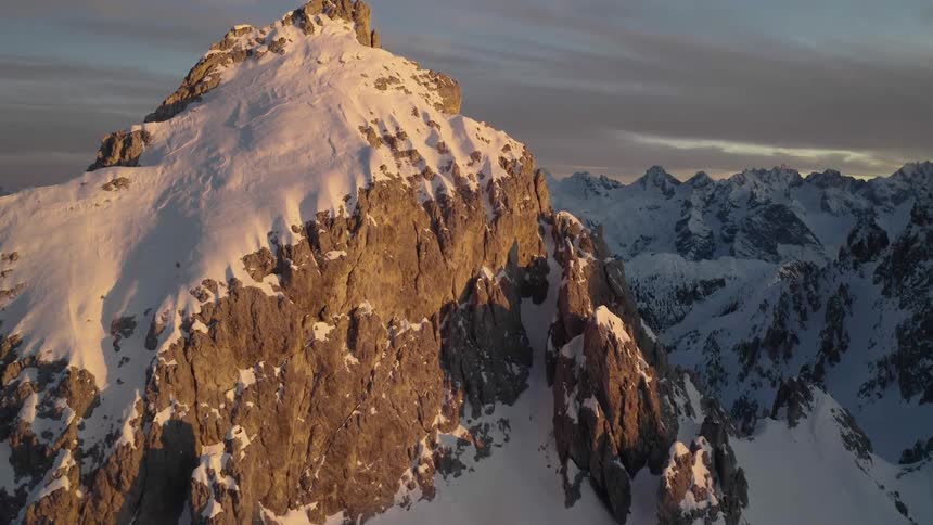 Aerial view of snow covered mountains