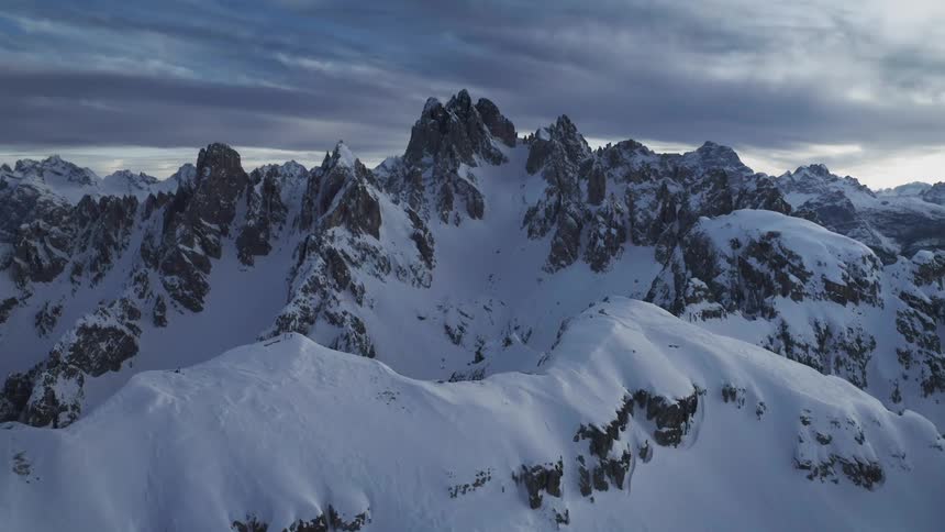 Aerial view of snow capped steep mountain ranges