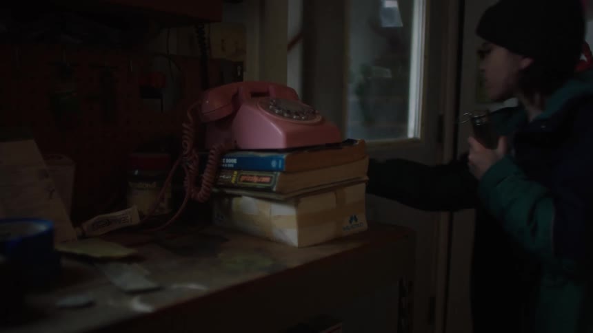 A boy grabs the flashlight and leaves the house