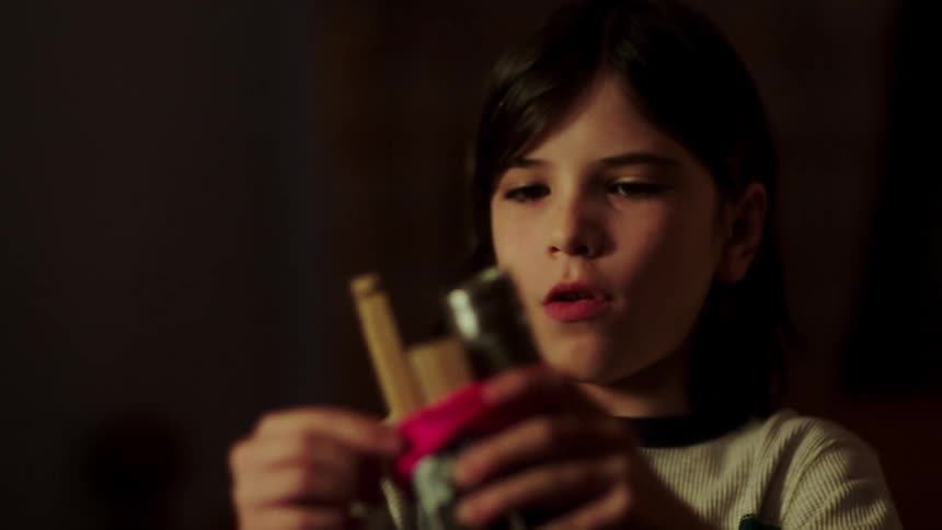 A child ties some items up