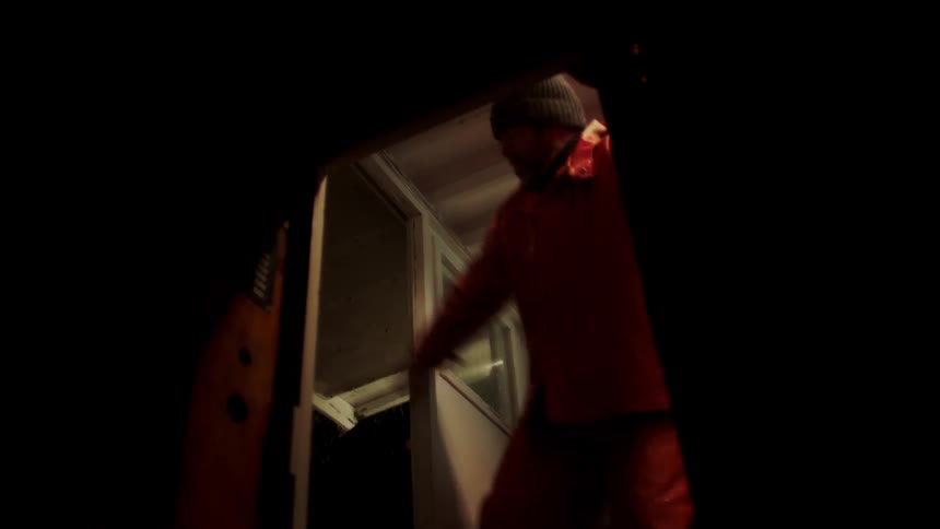 A man escapes the storm in the boat cabin