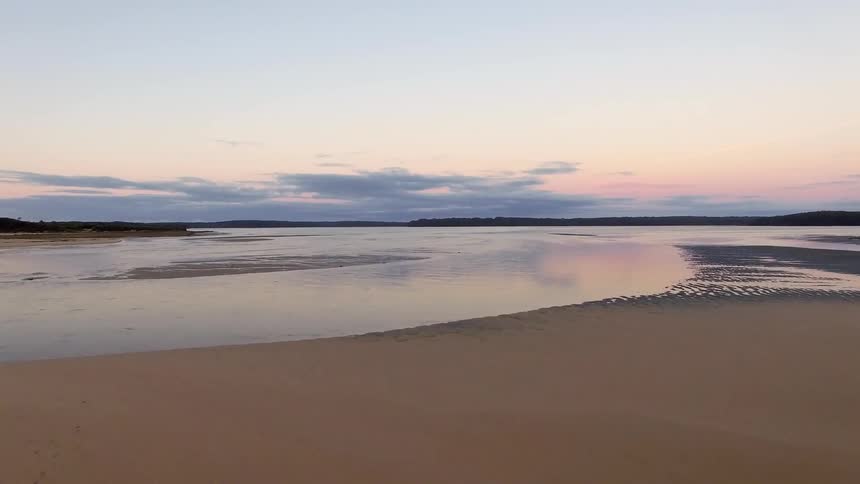 A beach is empty at sunset